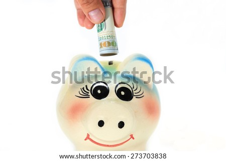 Saving money with piggy bank on white background