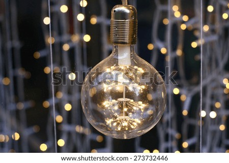 cool led lightbulb with light bokeh in the background
