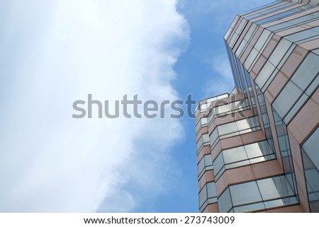 building on blue sky and cloud background