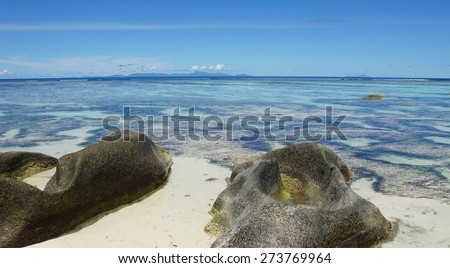 bizarre granite rocks on tropical beachon la digue 