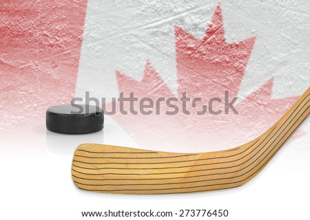 Stick, puck and hockey field with a Canadian flag. Concept