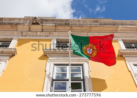 Portugal flag waving on the wind in front an administrative building
