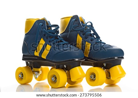 Vintage Retro Blue and Yellow Quad Roller Skates on White Background with Reflection. Royalty-Free Stock Photo #273795506