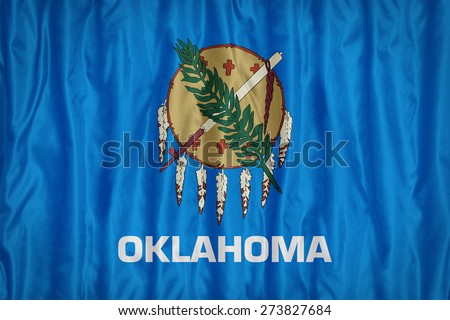 Oklahoma flag pattern with a peace on fabric texture,retro vintage style