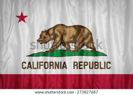 California flag pattern with a peace on fabric texture,retro vintage style
