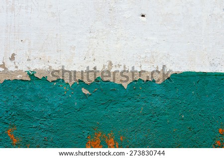 The two-tone horizontal old wall plastered and painted. textural composition