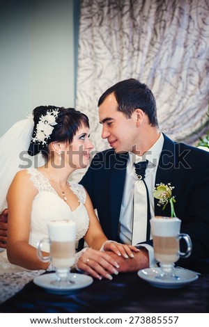 Love you honey.  Newly wed couple drinking cappuccino in cafe