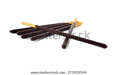 crackers stick and coated with back chocolate on white background