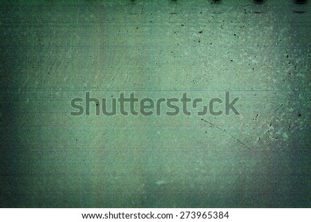 Green filmstrip texture background with heavy grain and dust