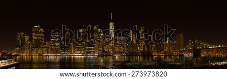 New York City Manhattan night panorama with Brooklyn bridge