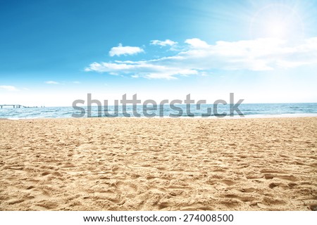 sun of summer time on sky and sand of beach  Royalty-Free Stock Photo #274008500