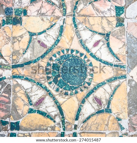 Colorful ancient roman marble floor, weathered and broken, heritage of italian history. Beautiful background and texture, vintage or antique style.