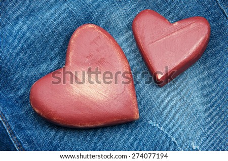 Red hearts on the jeans.