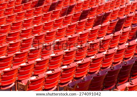 Rows of red seats at a stadium
