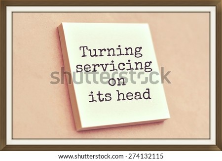 Text turning servicing on its head on the short note texture background