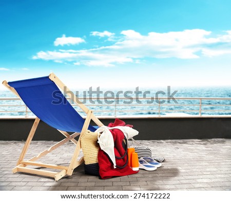 chair with bag pier and sea 