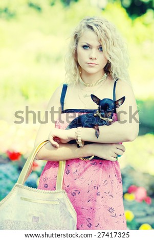 Fashion - girl and her little fancy friend, small cute dog