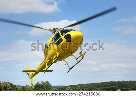 Helicopter rescue, helicopter in the air while flying. All logos and text removed.