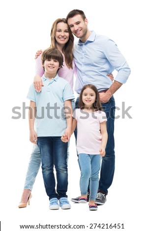 Young family with two children standing together
