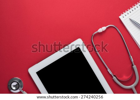 Stethoscope with digital tablet and note on the desktop. Medicine concept.Top view with copy space