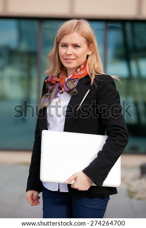 Blonde business woman with laptop