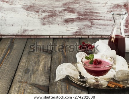 Cranberry jelly, cranberry juice and frozen cranberry on an old table background.Selective focus.