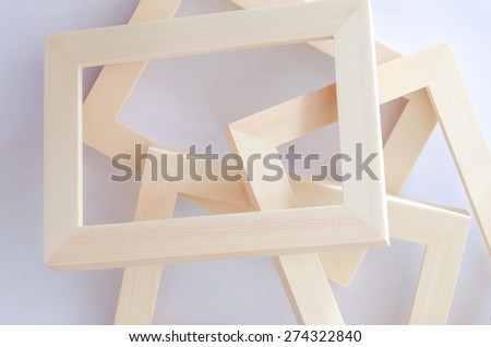 wooden photo frame on white background with soft shadows