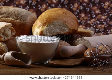 White bread flour and kitchen appliances closeup, horizontal picture