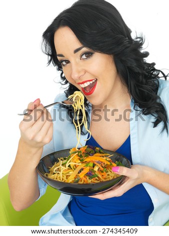 Young Healthy Woman Eating Noodles with Stir Fried Vegetables