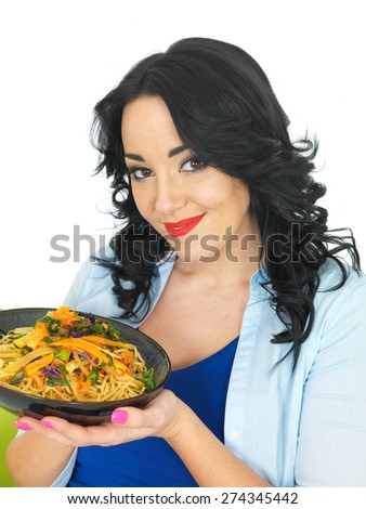 Young Healthy Woman Eating Noodles with Stir Fried Vegetables