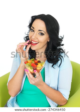 Young Healthy Woman Eating a Fresh Fruit Salad
