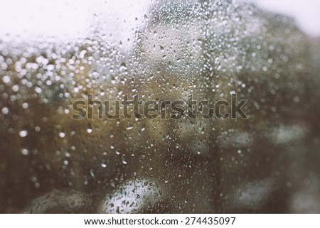 rain drops on window retro filter city background