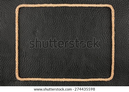 Frame of rope, lies on a background of a black natural leather, with place for your text
