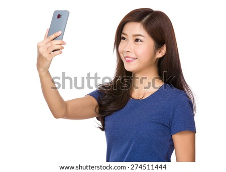 Woman take selfie by using mobile phone
