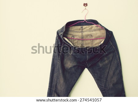 Vintage,Jeans hanging on the wall