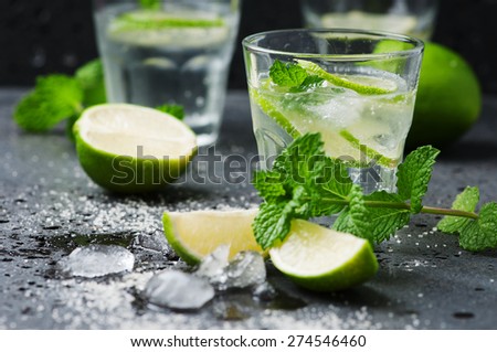 Mojito cocktail in a bur on a rustic table, selective focus Royalty-Free Stock Photo #274546460