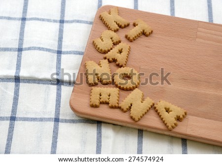 Biscuits ABC on wooden plate