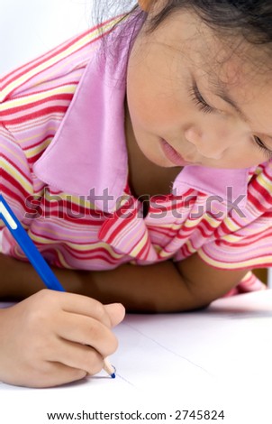 A young girl draws a picture. Education, childhood
