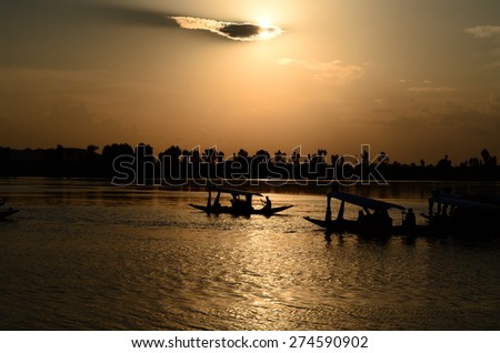 Boats during sunset at Dal Lake,Kashmir,India