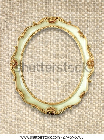 Vintage golden frame on linen fabric background