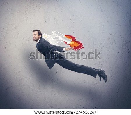 Businessman flying with rocket backpack