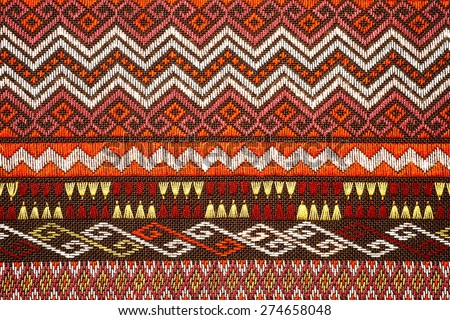 More than 100 years old colorful thai handcraft peruvian style rug surface old vintage torn conservation Made from natural materials Chemical free close up. Royalty-Free Stock Photo #274658048