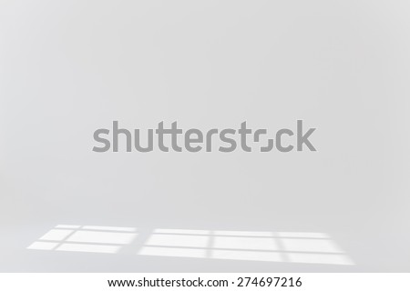 Plain white background with sun light and shadows 