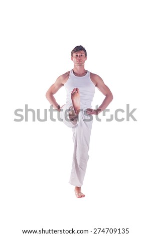 Man practicing yoga doing the " Hand-To-Big-Toe " posture. Utthita hasta padangusthasana