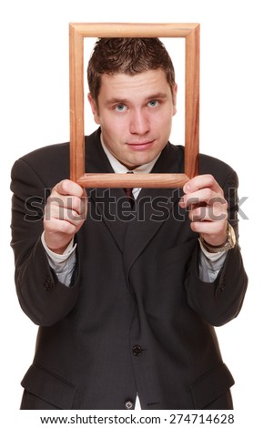Nerdy funny business man guy framing his face with wooden empty picture frame isolated on white background