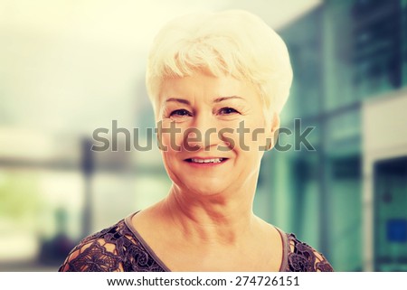 Portrait of and old, casual woman