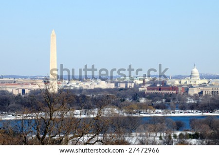 Skyline of Washington DC in winter, including the Washington Monument, the National Mall and the Capitol, as seen from Arlington, Virginia, across the Potomac River.