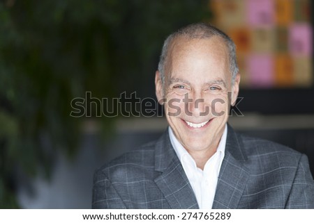 Mature Businessman Smiling At The Camera