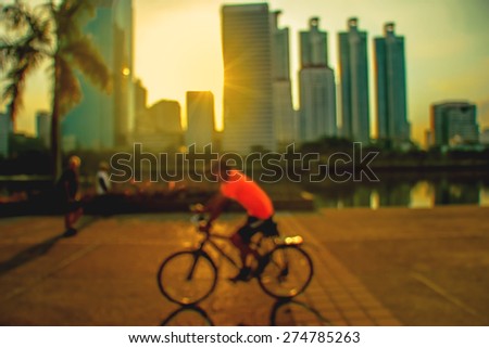 Silhouette,The man biking taken with low speed shutter,motion blur
