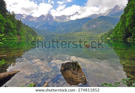 Alpine lake in the forest on summer